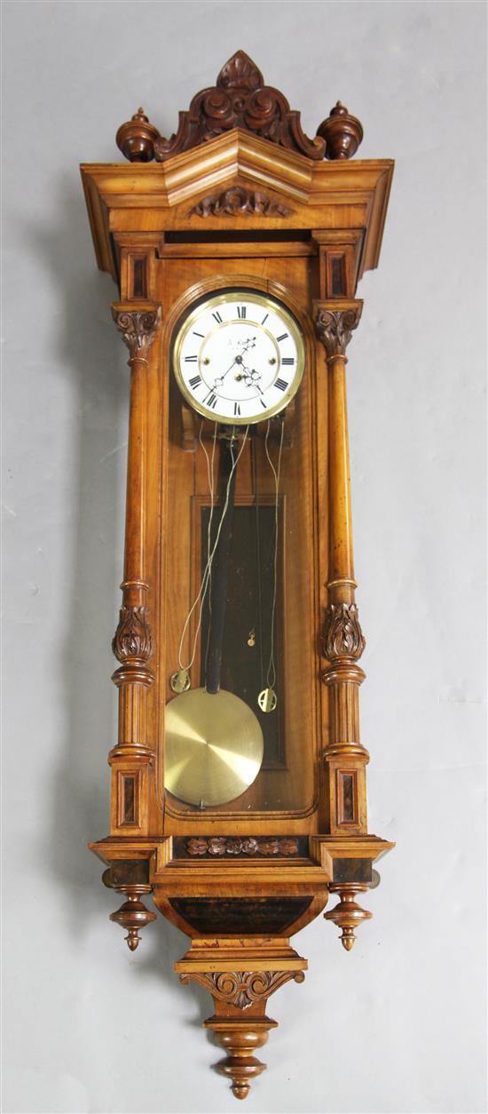 A 19th century walnut cased Vienna regulator, H.51in.